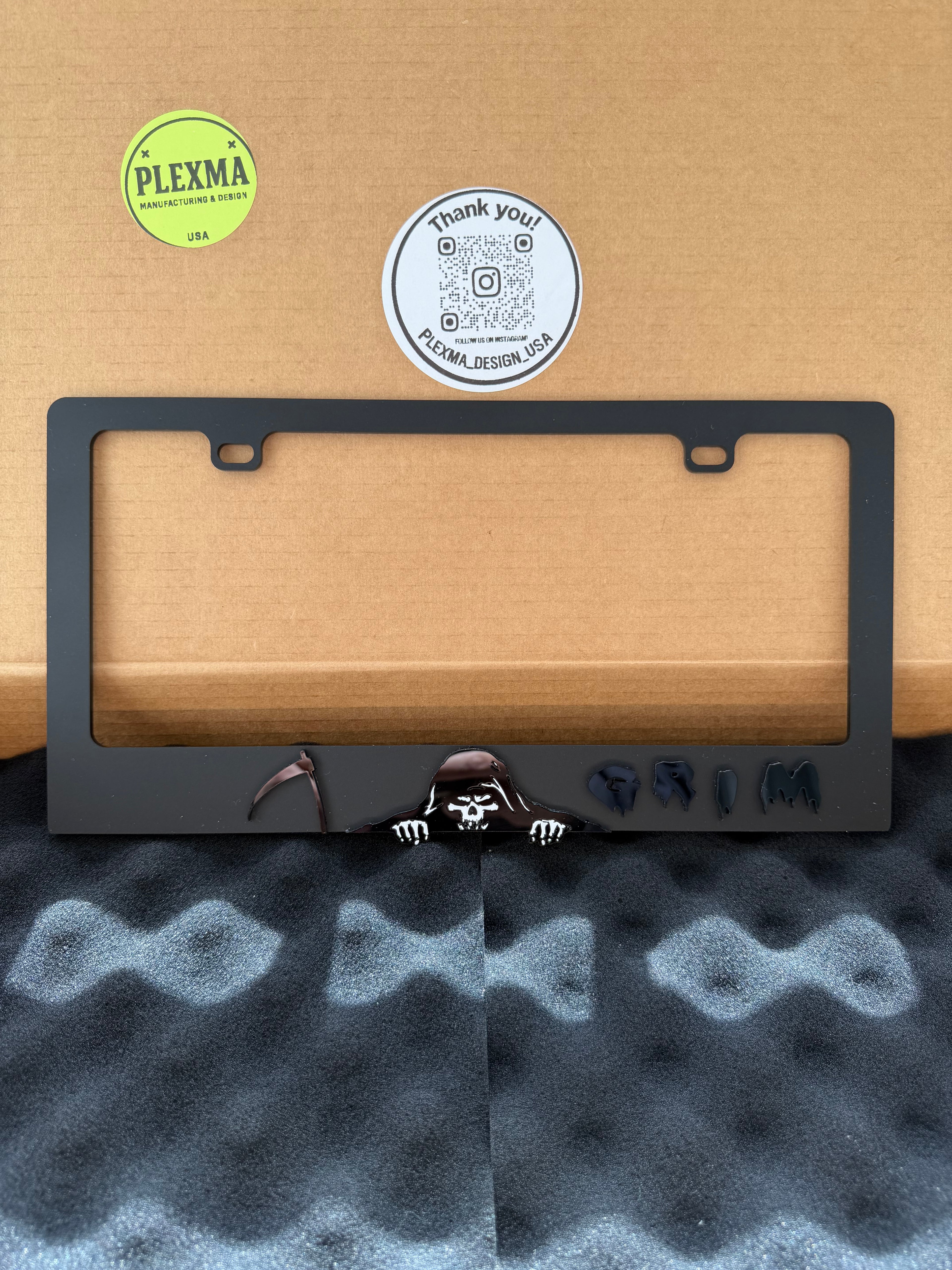 Grim Reaper 3D license plate frame in glossy black acrylic, handmade car accessory