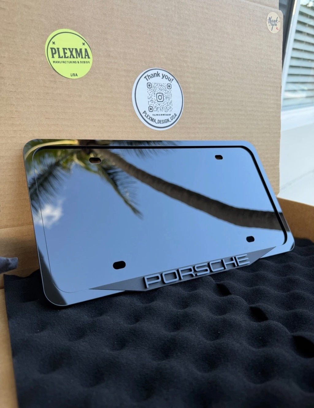 Porsche 3D black acrylic license plate frame with raised logo, handmade in USA