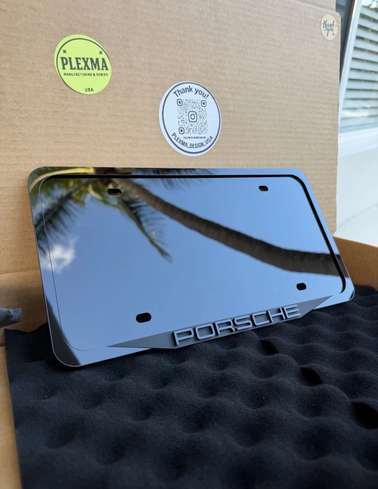 Porsche 3D black acrylic license plate frame with raised logo, handmade in USA