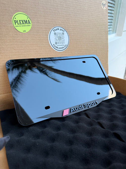 Audi Sport 3D black acrylic license plate frame with raised logo, handmade in USA