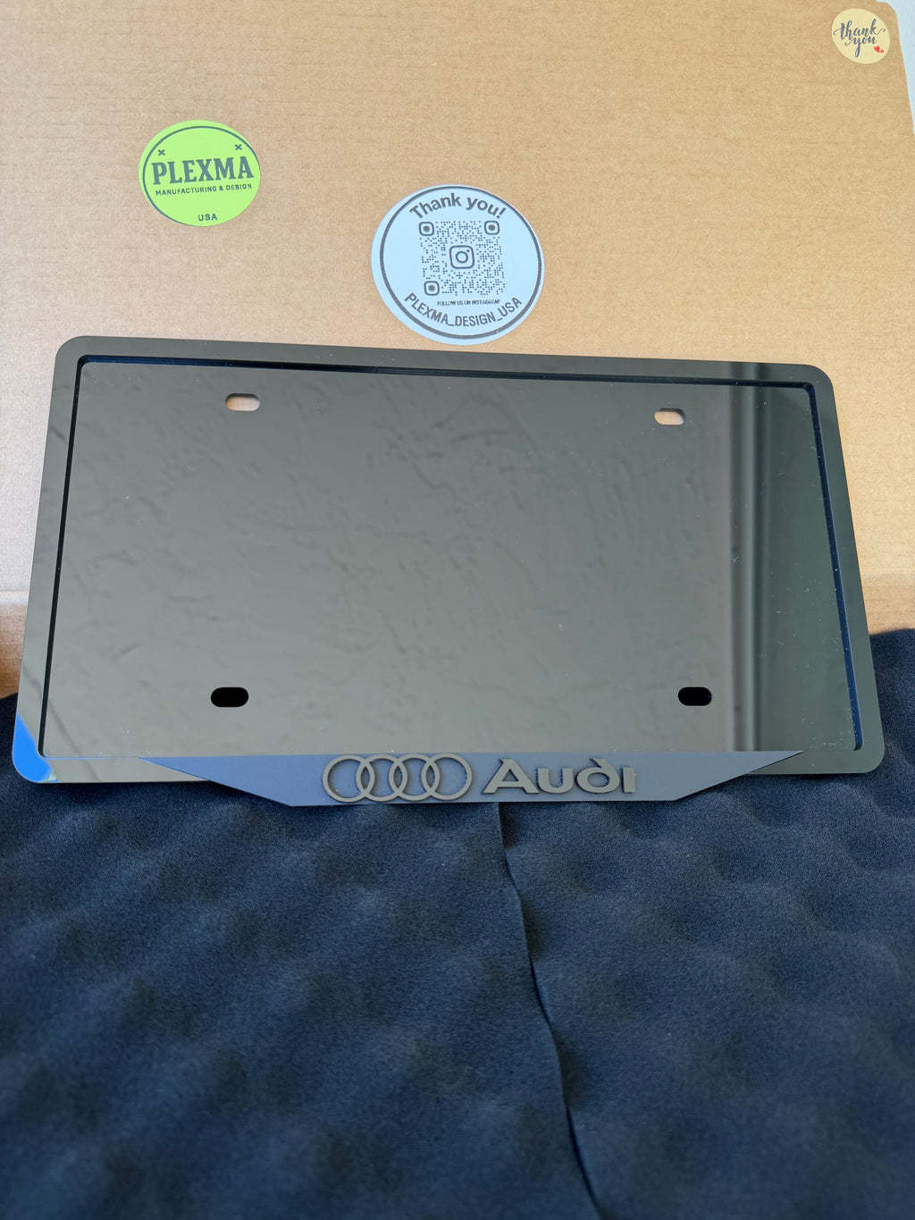 Glossy black Audi license plate frame, layered acrylic, front and rear fit