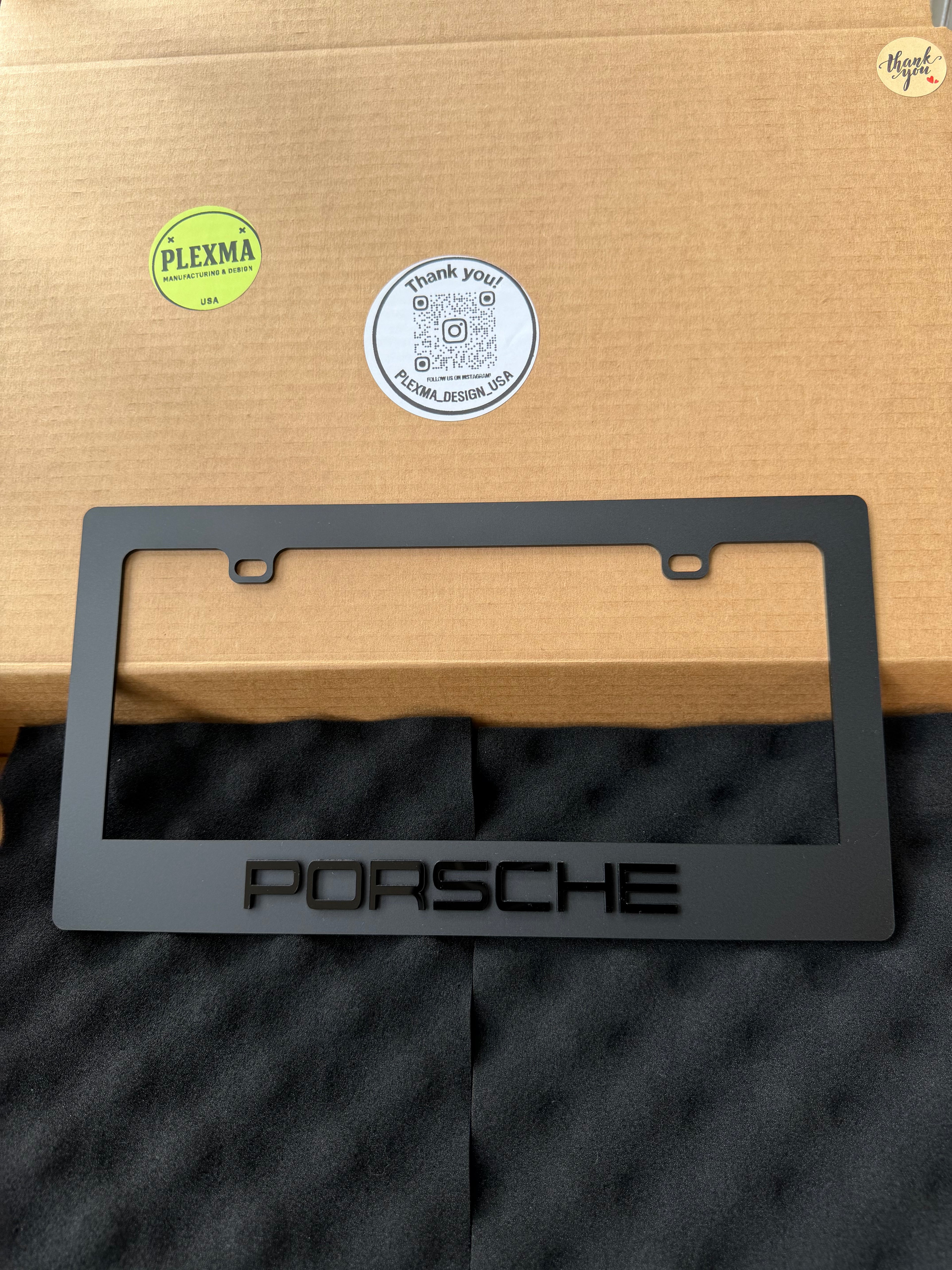 Porsche custom emblem license plate frame with raised 3D logo, black acrylic finish