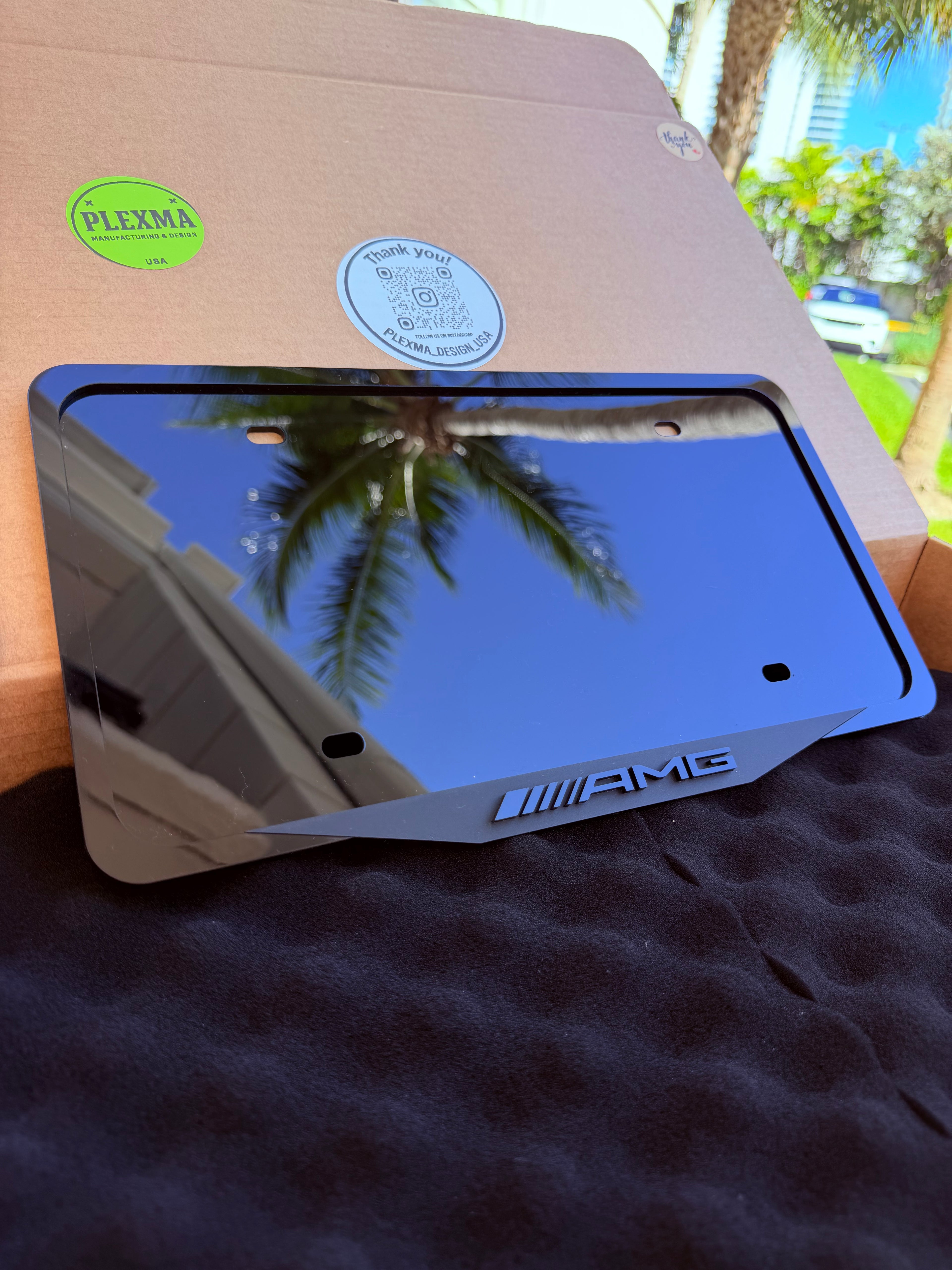 Mercedes AMG license plate frame installed on car, 3D layered acrylic design
