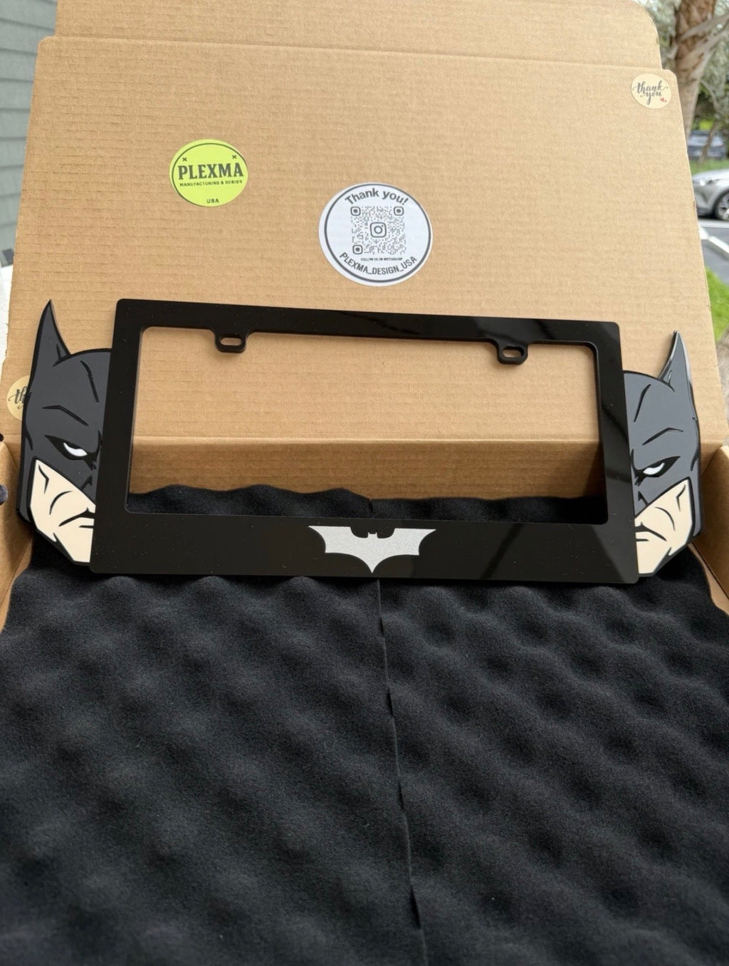 Glossy and matte black Batman 3D layered acrylic license plate frame detail