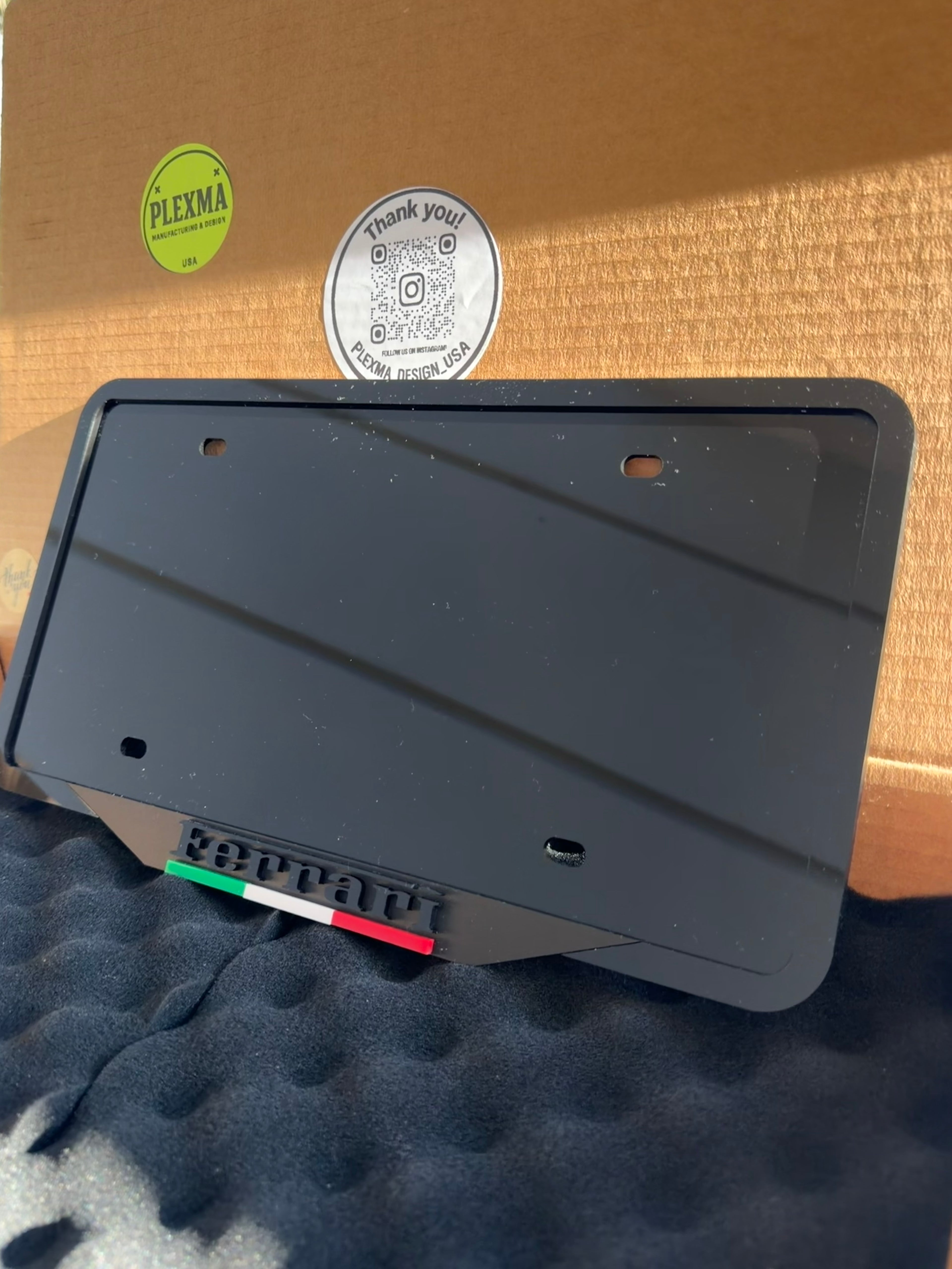 Glossy black 3D acrylic license plate frame custom made for Ferrari vehicles