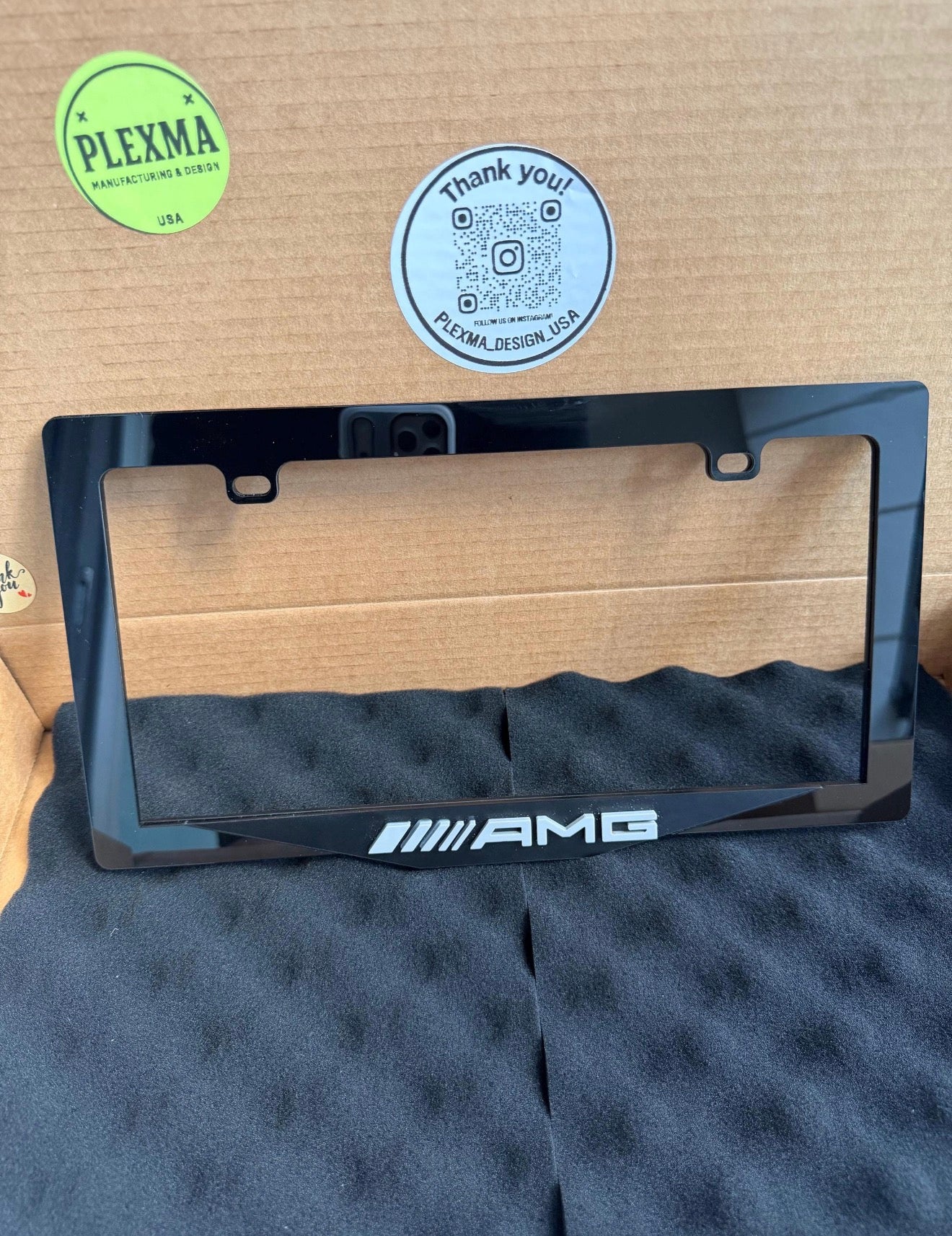 High-end Mercedes-Benz AMG plate frame with raised emblem, black acrylic handmade