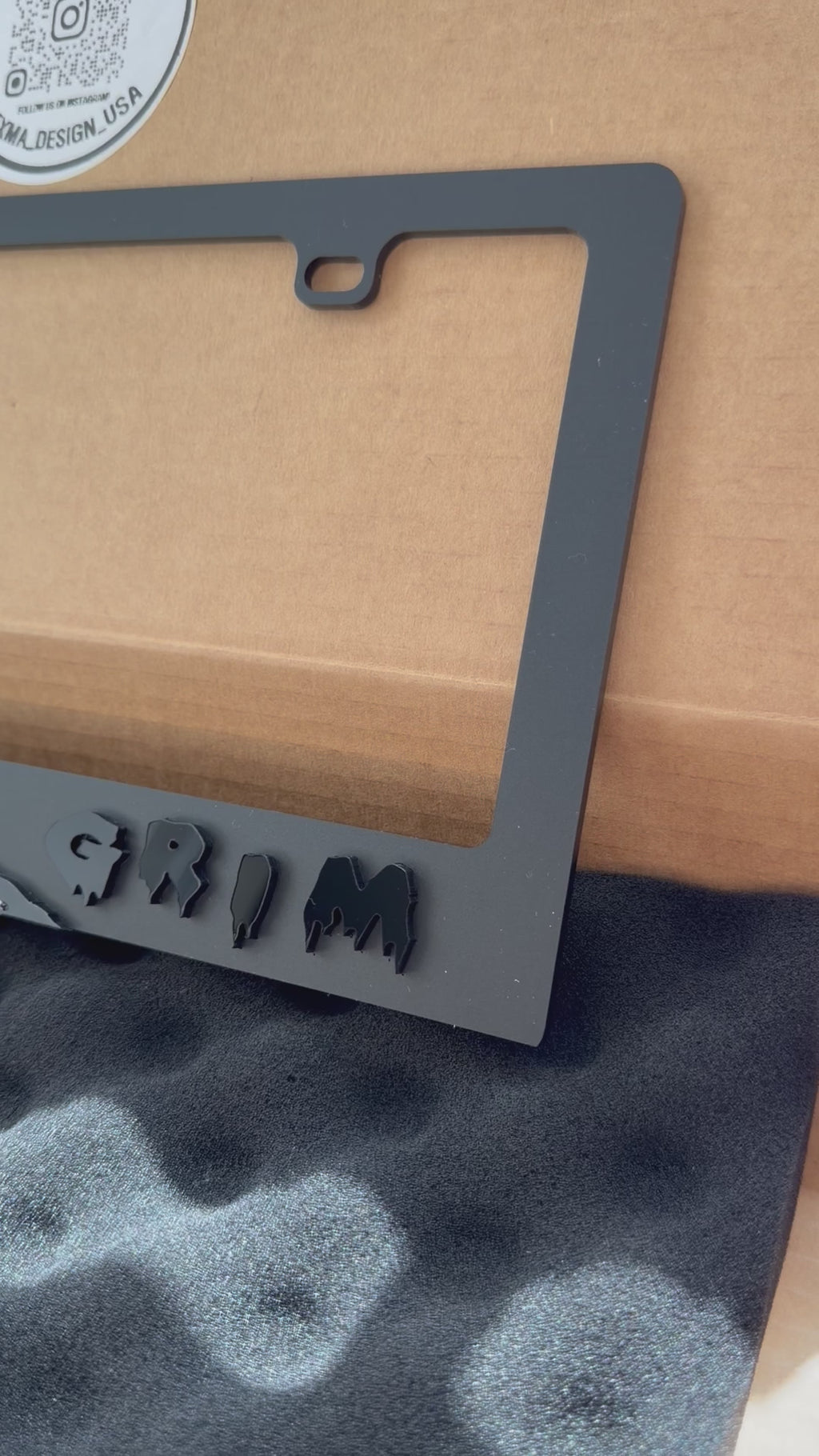 Black acrylic Grim Reaper license plate frame with raised 3D design, USA made